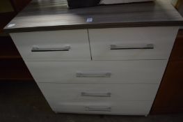 Modern white lacquer bedroom chest, a G plan bookcase and a suitcase.
