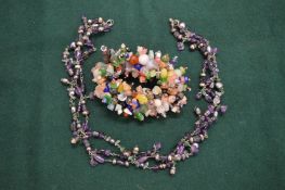 Decorative multi-coloured bead necklace and similar bracelet.