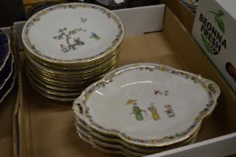 A Limoge porcelain part dessert service decorated with Chinese figures.