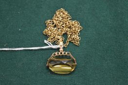 A swivel fob seal with yellow metal chain, the clasp stamped 9ct.