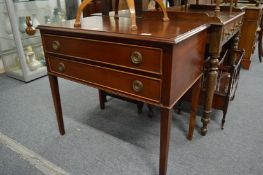 A mahogany two drawer chest on tapering square legs.