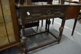 A 17th century style oak single drawer side table.