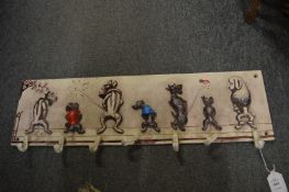 A novelty cast iron coat hook.