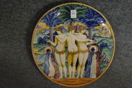 An Urbino plate decorated with the three graces.