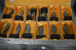 A collection of fourteen reproduction Egyptian Shabtis in a presentation box.