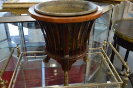 A Dutch mahogany jardiniere with copper liner and ormolu mounts to the curving legs.