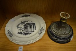 A set of four cream ware plates and a brass stand.