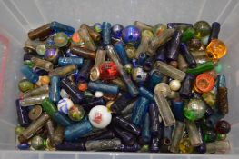 A quantity of marbles and other glassware.