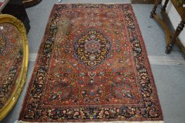 A good Persian carpet, red ground with stylised floral decoration, 200cm x 135cm.