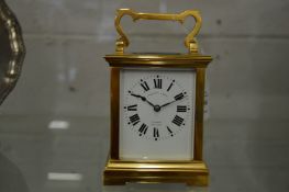 A large brass carriage clock, the dial signed Penlington & Batty, Liverpool, the movement striking