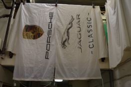 A Jaguar and Porsche flag.