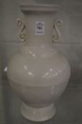 A Chinese large blanc de chine vase with S shaped handles.
