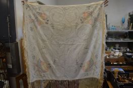 A hand embroidered shawl or table cover.