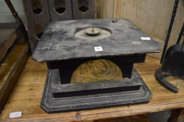 The base of an early gramophone.