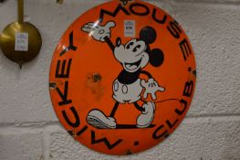A Mickey Mouse enamel sign.