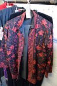 A ladies embroidered jacket, a velvet jacket and a black velvet cape.