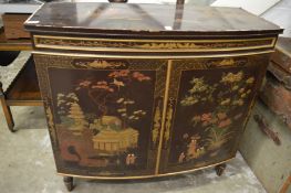 A chinoiserie decorated bow fronted two door cabinet.