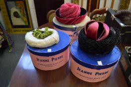 A small collection of stylish ladies hats housed in three Jeanne Pierre hat boxes.
