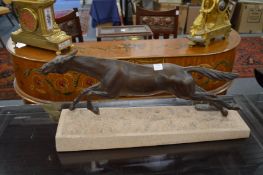 Max Le Verrier, A bronze leaping horse on a naturalistic carved marble base.