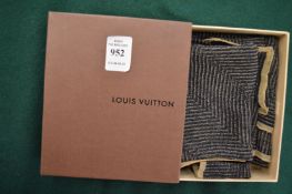 A Louis Vuitton ladies head scarf with original box.