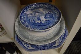 Two blue and white dishes and a similar stand.