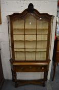 A good Dutch style walnut display cabinet on stand.