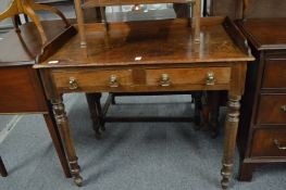 A 19th century mahogany two drawer side table with galleried back.