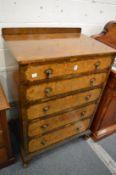 A figured walnut five drawer chest.