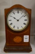 A small Edwardian inlaid mahogany mantel clock.