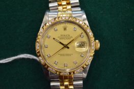A gentlemans Rolex Oyster Perpetual Datejust stainless steel and gold wristwatch with champagne
