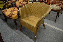 A lloyd loom armchair.