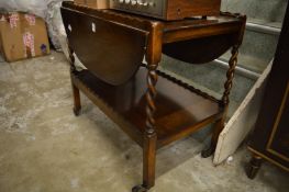 An oak drop-flap two-tier tea trolley.