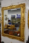 A decorative gilt framed mirror.