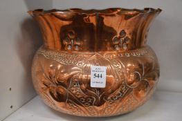 An Art Nouveau embossed copper jardiniere.