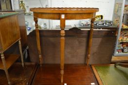 A mahogany demi-lune table.