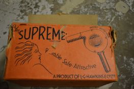 An early hair dryer with original box.