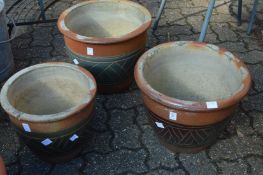 Three various terracotta planters (one cracked).