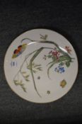 A Minton cabinet plate decorated with butterflies and flowers.