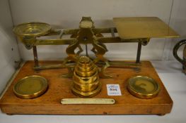 A set of postal scales and weights.