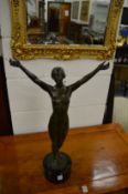 A good bronze standing female nude, her arms out stretched, on a later marble base, the bronze