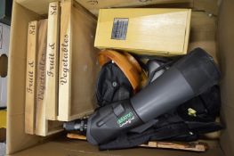 A spotting scope and other items.