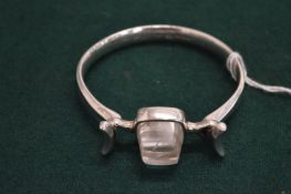 A Georg Jensen silver and rock crystal bangle.