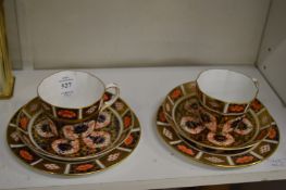 Two Royal Crown Derby Imari pattern trios.