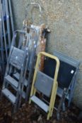 Six various step ladders.