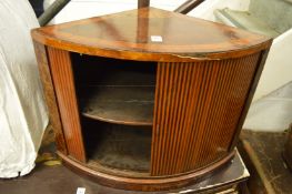 An inlaid mahogany bow fronted hanging corner cupboard.