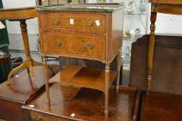 A mahogany two drawer chest with under tier.