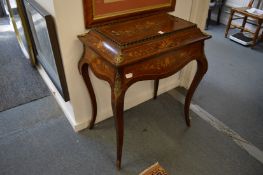 A 19th century rosewood and marquetry inlaid jardiniere on cabriole legs.