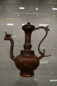 An Islamic bronze ewer.