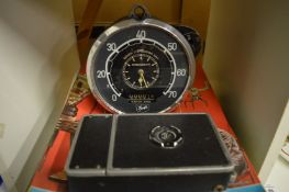 A speedometer and other items.