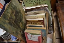 Various books and a print of the Hay Wain.